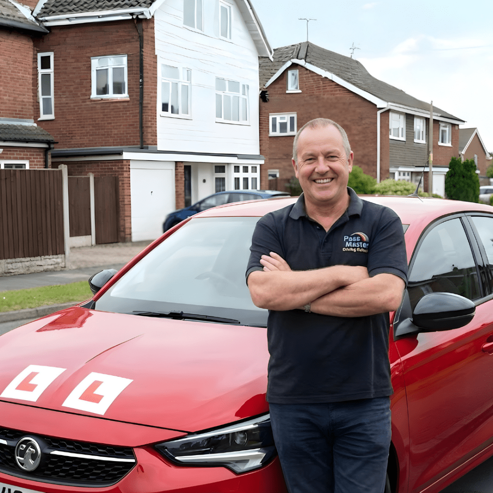 driving instructor standing in front of his learner car
